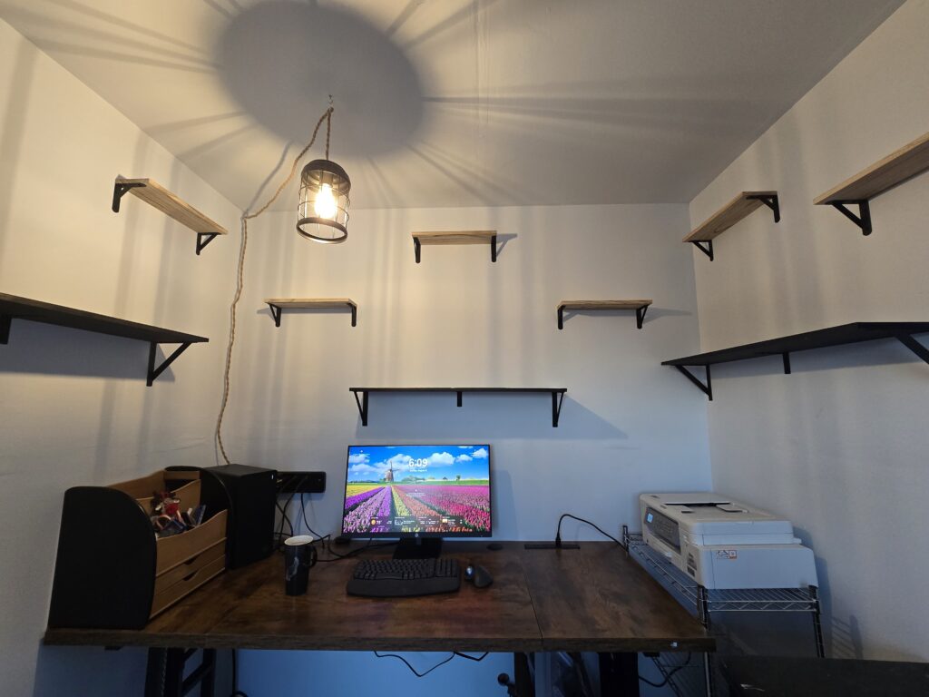 Debbie’s She Shed after its remodel—Pixel, shelves, and a desk ready for storytelling and scrolls.
